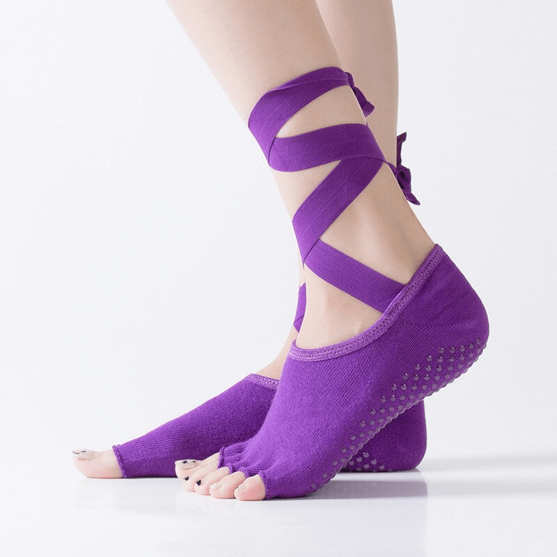 Women's purple elastic non-slip yoga socks with open toes and ties for secure fit, perfect for enhancing your yoga practice.